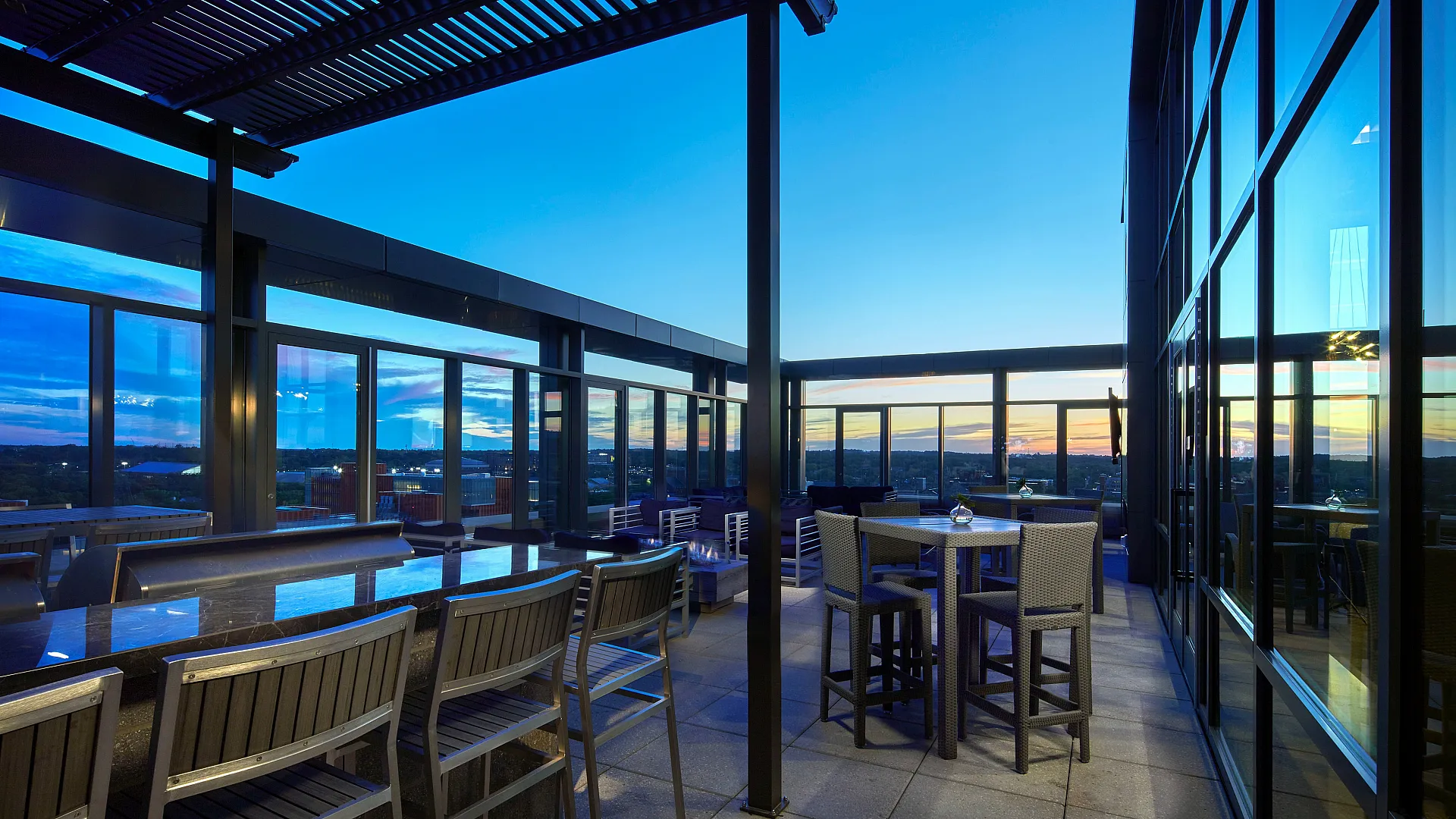 Modern rooftop terrace with sunset view