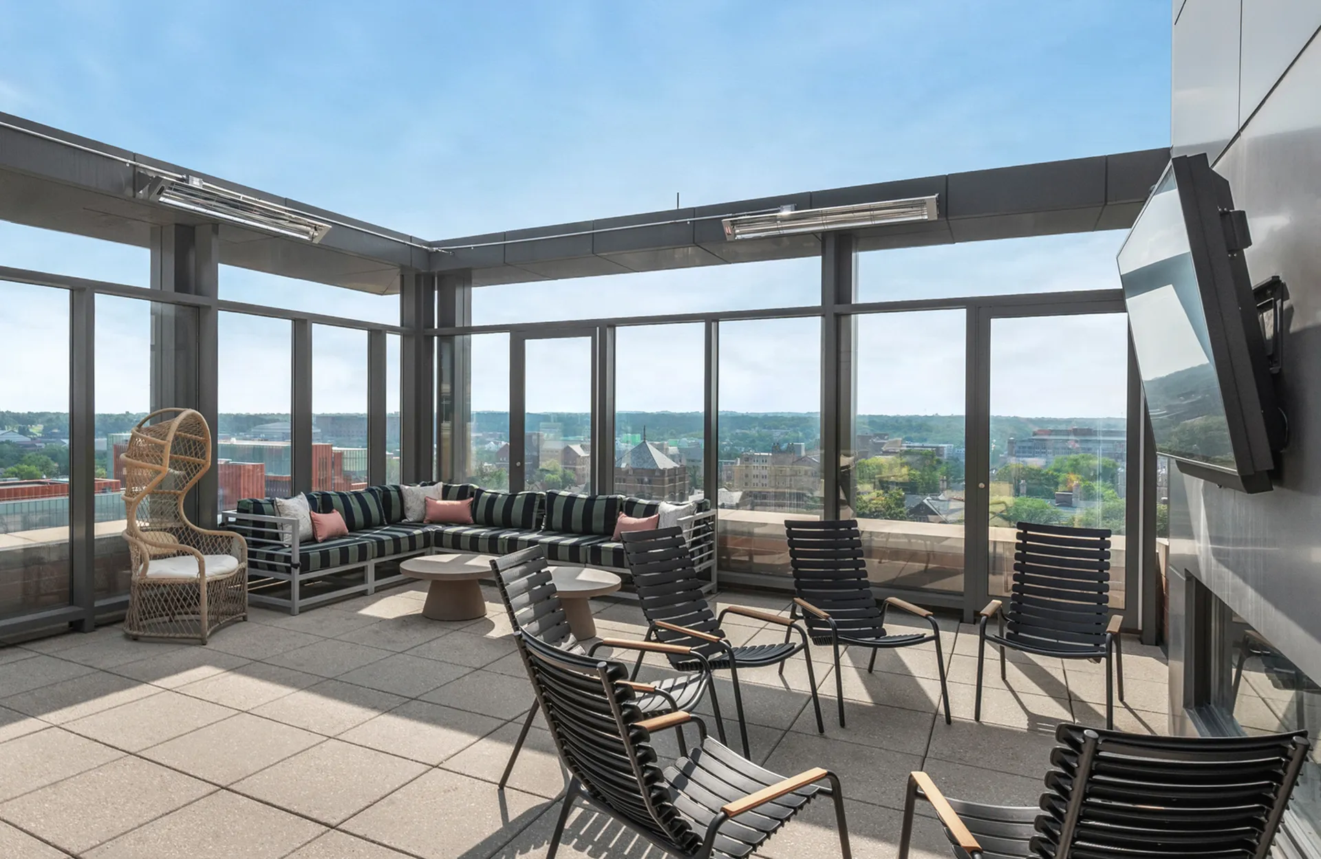 Modern rooftop lounge with city view
