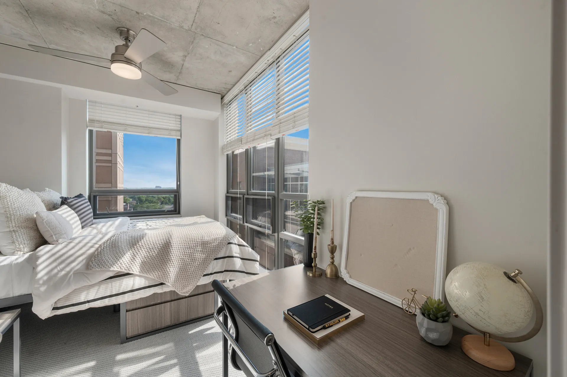 Modern bedroom with workspace and view