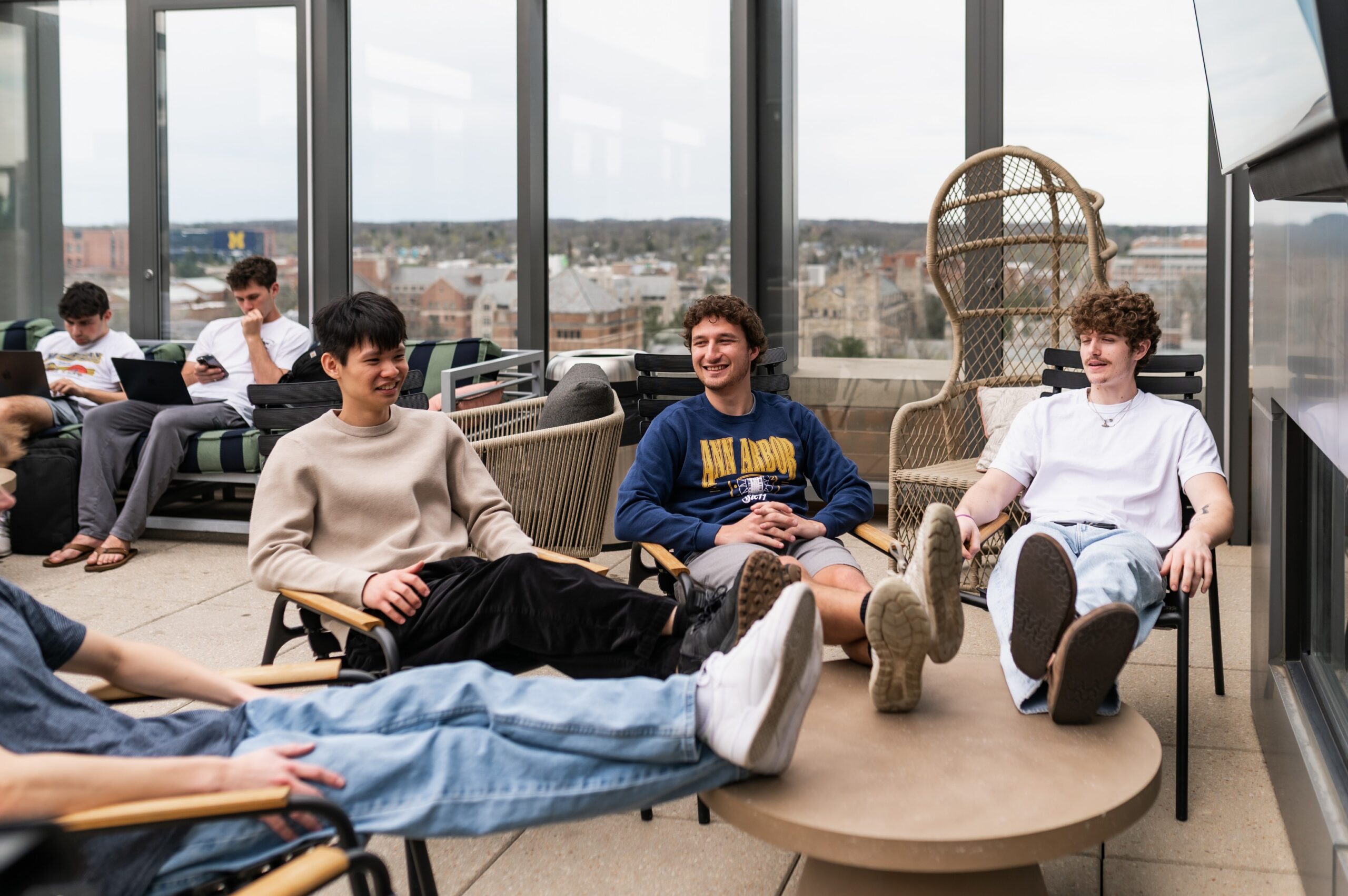 Six11 residents relaxing at the rooftop lounge